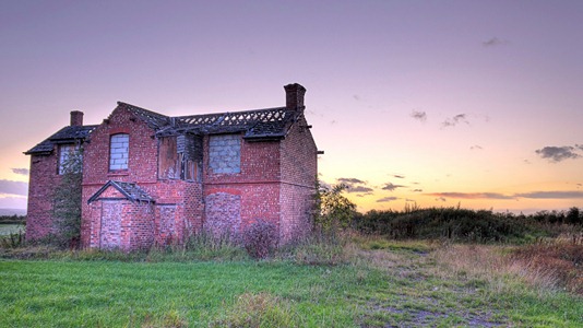 Abandoned house at sunset